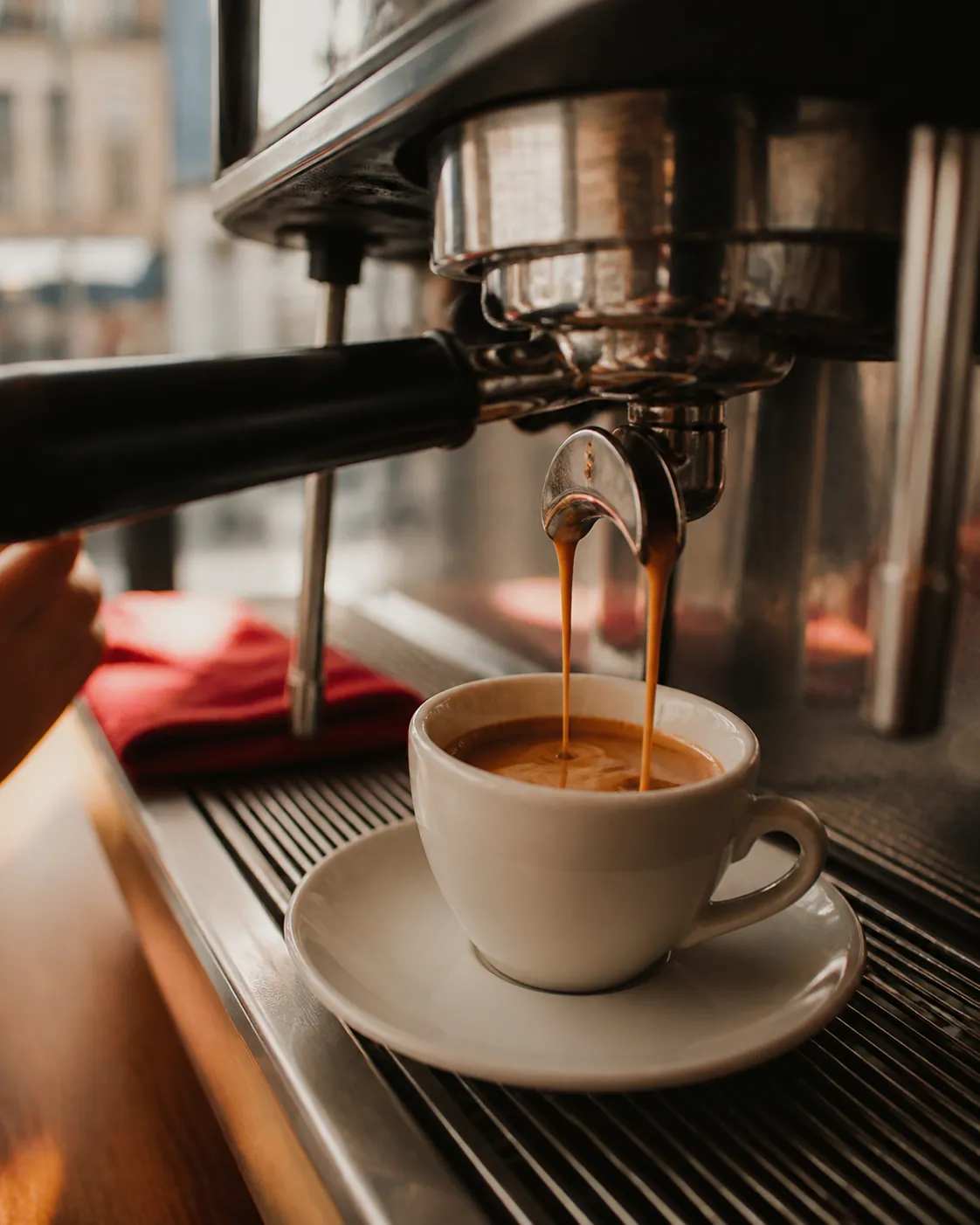 An espresso being pulled at the counter
